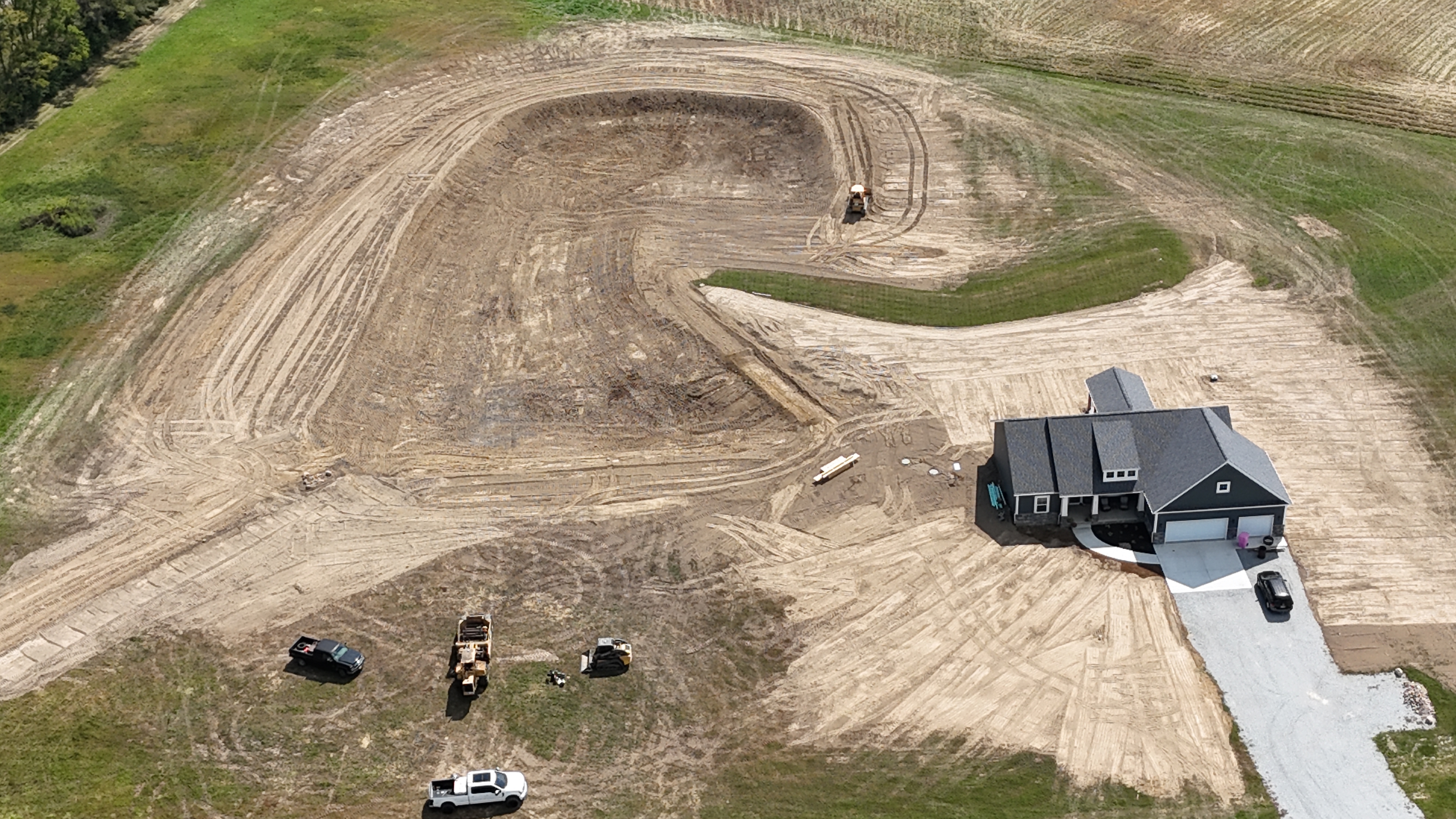 Aerial view of William Moore Excavating project — large-scale land grading near a new home in Fletcher Ohio